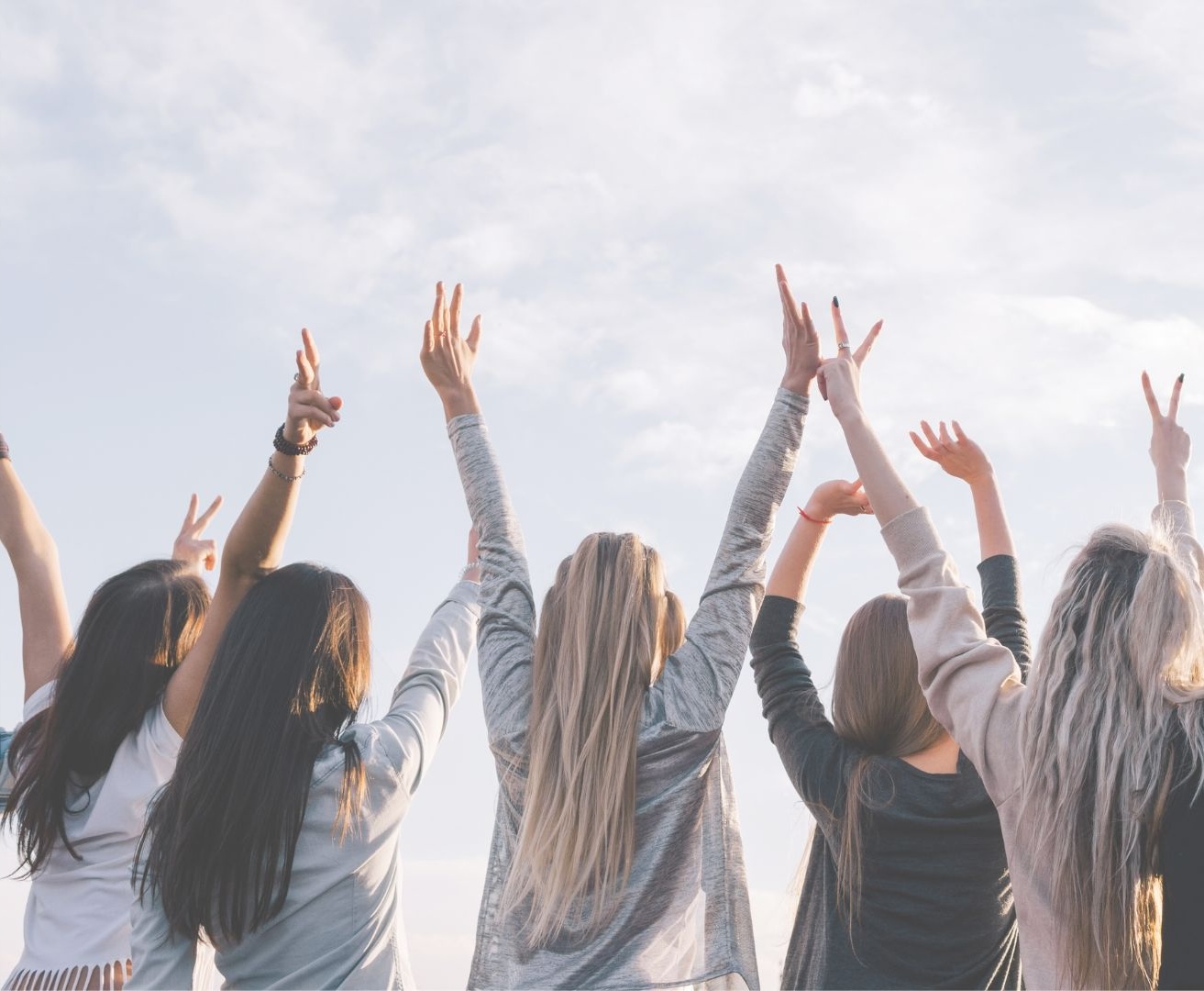 Women with their hands in the air